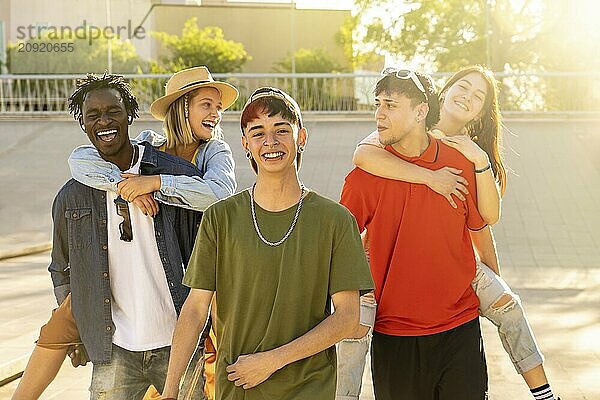 Happy group of young multiethnic friends. Friends smiling and enjoying the outdoors. Concept of community and unity of the people