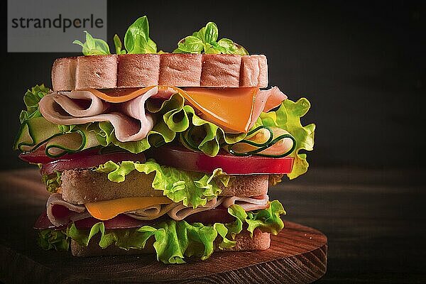 Club sandwich  on a wooden table  rustic style  close-up  no people  homemade