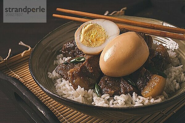 Stewed eggs  with pork belly  and rice  chinese food  homemade  selective focus  rustic  no people