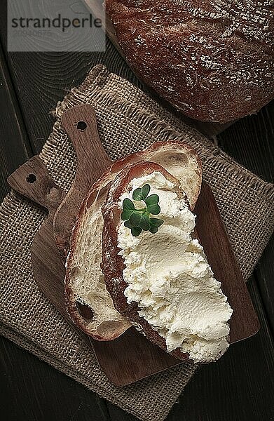 Sandwich  with cream cheese  homemade  on a cutting board  rustic style  no people  selective focus  breakfast