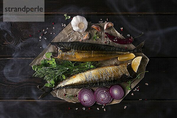 Smoked mackerel  top view  with spices  on a wooden table  no people  selective focus