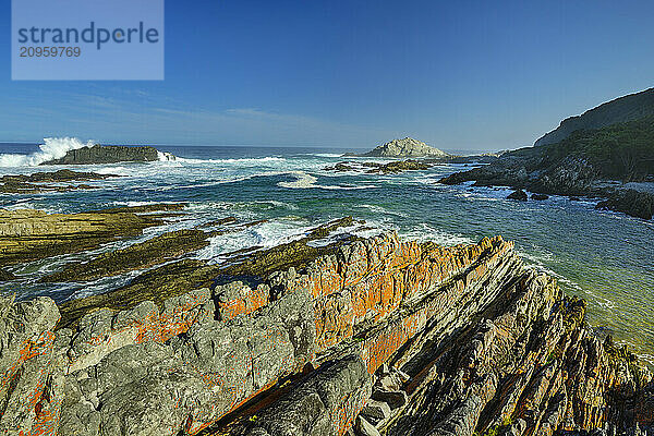 Rock formations near sea at Blue Bay beach in Tsitsikamma Section  Garden Route National Park  Eastern Cape  South Africa