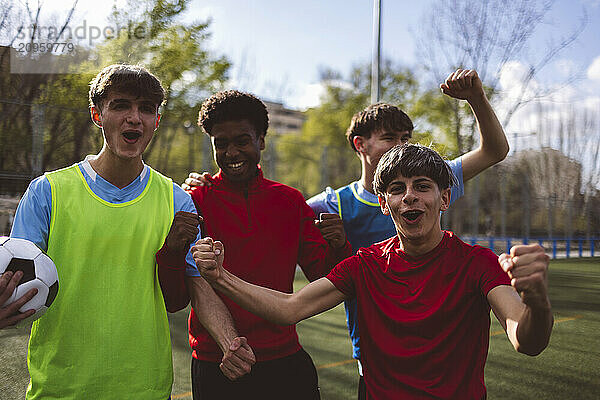 Happy soccer players winning match