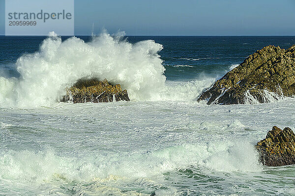 Waves breaking on rocks in sea at Kranshoek Hiking Trail in Garden Route National Park  Western Cape  South Africa