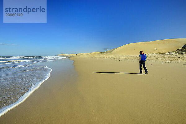 Woman walking near shore at beach in Eastern Cape  South Africa