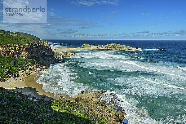 Waves breaking at sand beach in Garden Route National Park  Western Cape  South Africa