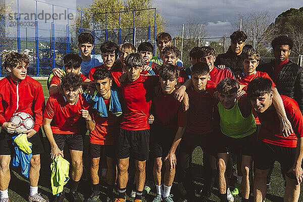 Soccer team standing together on sunny day