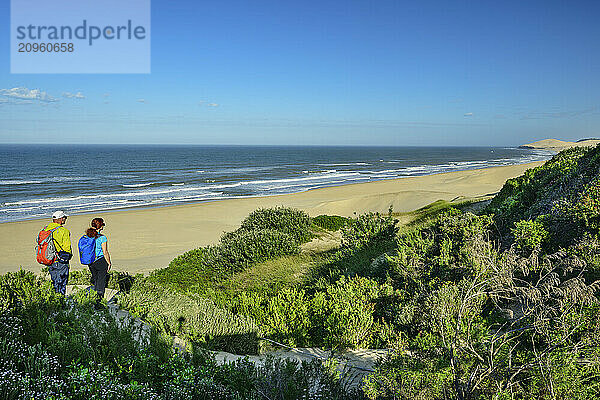 Man and woman hiking Alexandria trail at Addo Elephant National Park in Eastern Cape  South Africa