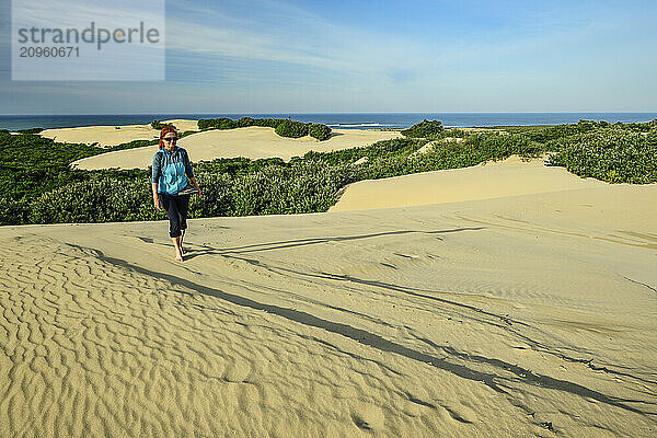 Woman walking on sand at Addo Elephant National Park in Eastern Cape  South Africa