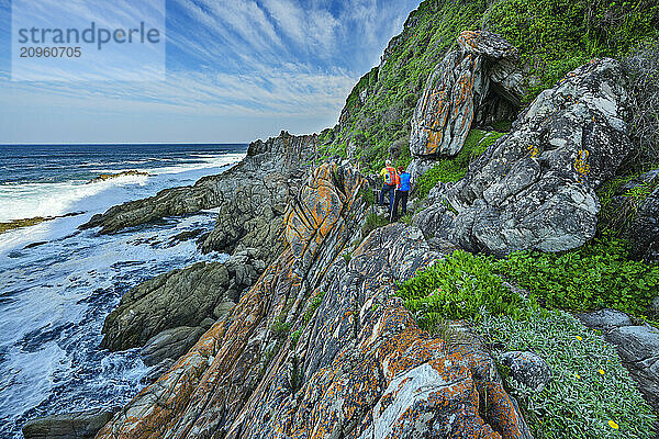 Hikers hiking on rocky Otter Trail in Tsitsikamma Section  Garden Route National Park  Eastern Cape  South Africa