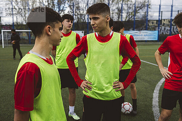 Soccer players practicing on field