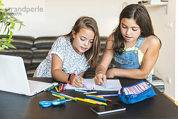 Friends coloring book with crayons at home