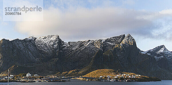 Snowcapped mountains of Lofoten And Vesteral Islands under cloudy sky