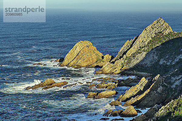 Coastline with incoming waves at Kranshoek Hiking Trail in Garden Route National Park  Western Cape  South Africa