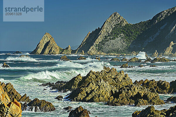 Rock spires in sea at Kranshoek Hiking Trail in Garden Route National Park  Western Cape  South Africa