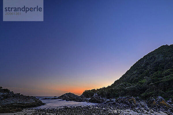 Dramatic sky over Indian Ocean at dusk in Tsitsikamma Section  Garden Route National Park  Eastern Cape  South Africa