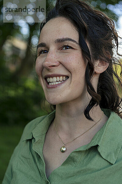 Happy beautiful woman with curly hair