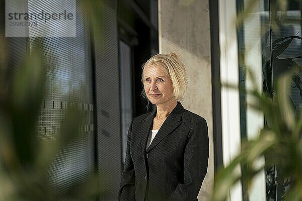 Thoughtful businesswoman with blond hair