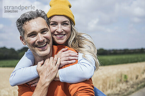 Happy loving couple enjoying together on sunny day