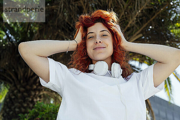 Smiling young woman with headphones