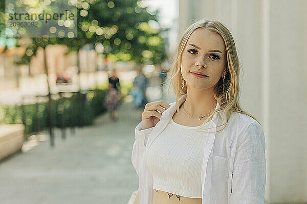 Blond hipster woman at street