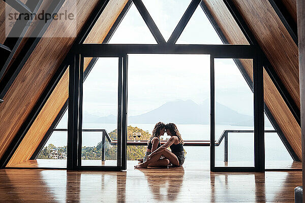 Couple sharing quiet moment in Guatemala cabin