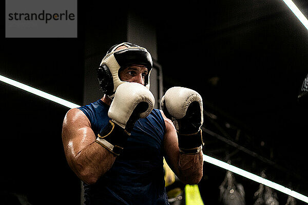 Boxers fighting in boxing training in the gym.