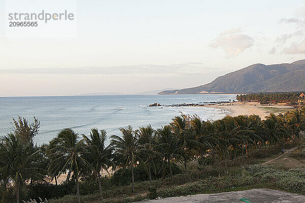 Sunset paints the sands and sea of Sun and Moon Bay on Hainan Island  China.