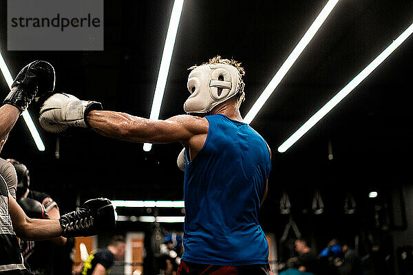 Boxers fighting in boxing training in the gym.