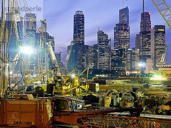 Shipping containers  cranes  freight ships and construction at The Port Authority of Singapore.