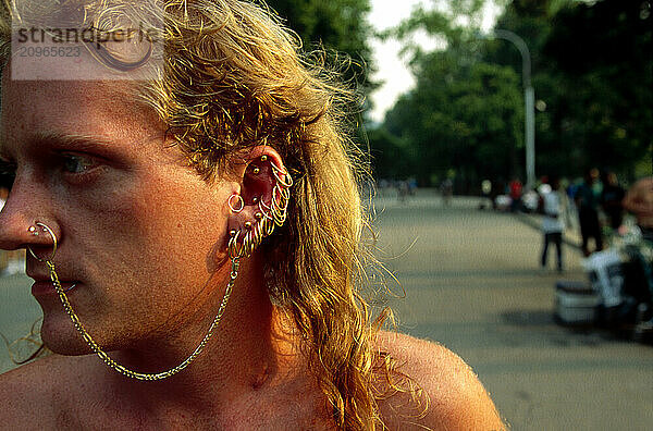 A man with many piercings.