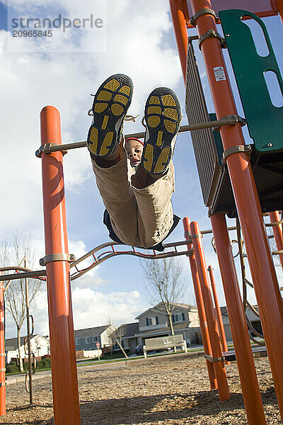 Young boy playing in playground in Sacramento  CA.