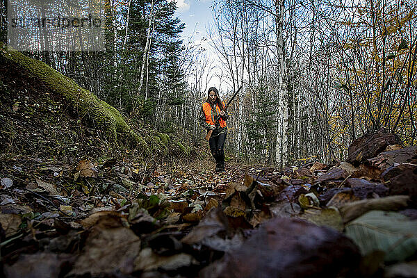 Portrait of young woman out hunting  Biwabik  Minnesota  USA