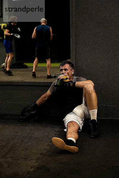 man after boxing training in the gym.