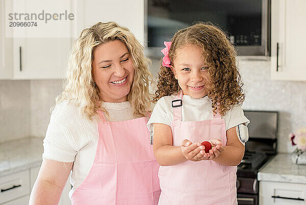 Mother and daughter smiling together