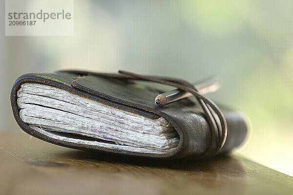 Still life of journal and pencil.