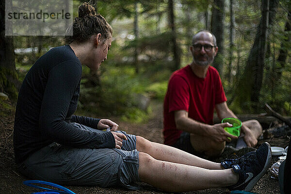 Hikers resting in forest  New York  USA