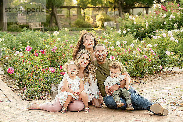 Biracial family of five smiling