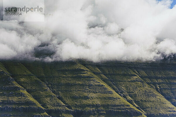 Clouds against mountains  Mikladalur  Faroe Islands