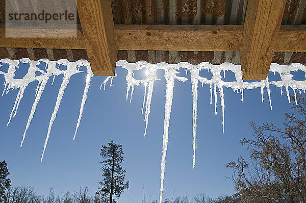 Icicles hanging off roof  Durango  Colorado.