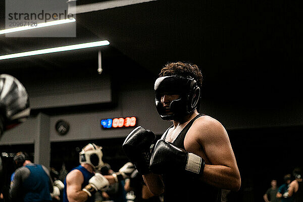 Boxers fighting in boxing training in the gym.