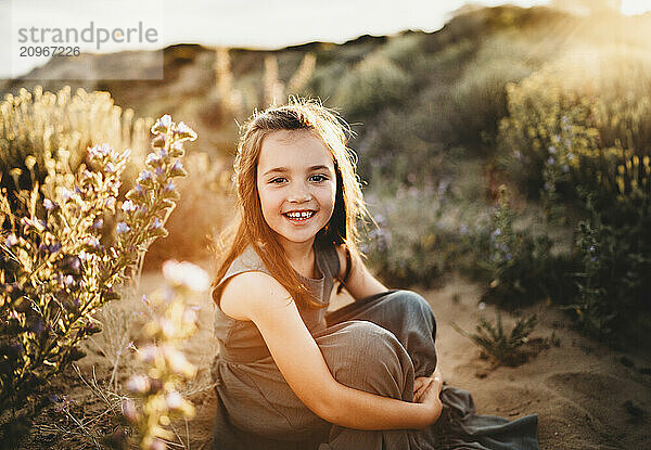 Beautiful white girl smiling at beach on Summer day in Spain