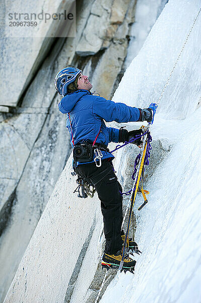 A photographer photographs an ice climber in Calif.