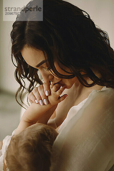 Beautiful portrait of a mom breast feeding baby. Happy mother