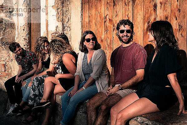 Young Man Smiling with Group of Friends