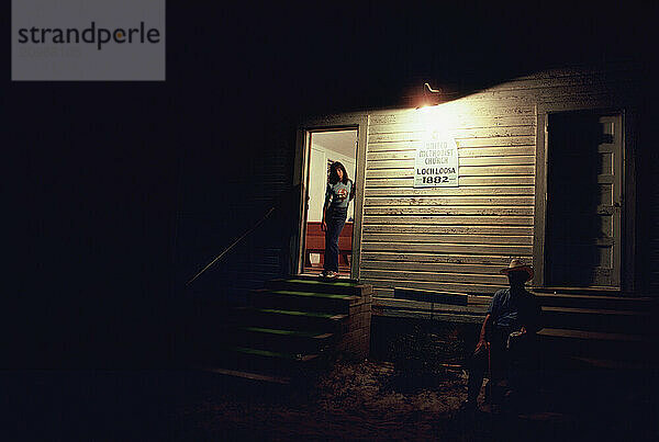 A United Methodist Church at night.