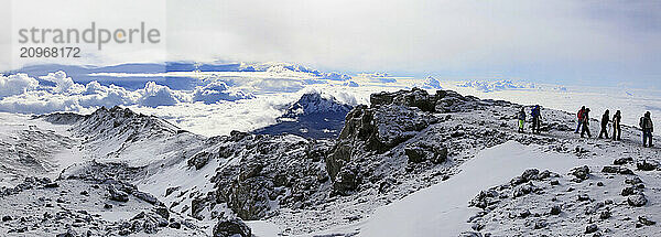 Climbers ascending the crater rim of Mt. Kilimanjaro  up from Stella Point  as seen from the summit area.