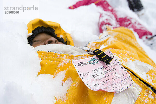 Young girl playing in snow at Kirkwood ski resort near Lake Tahoe  CA.