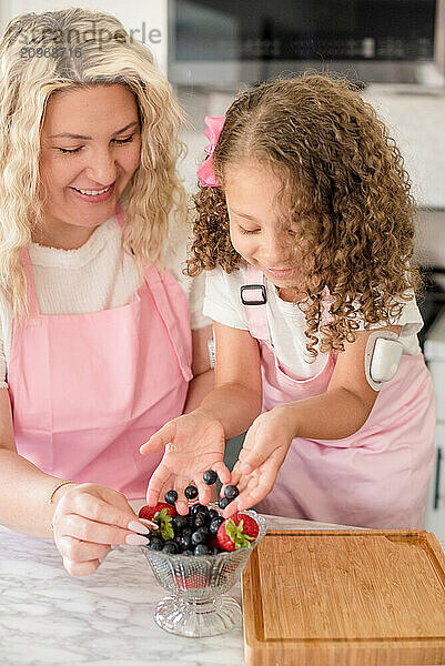 Close up of little girl with diabetes and mother next to her