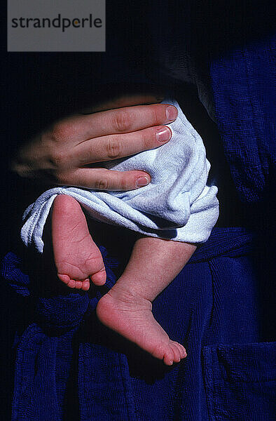 Close-up of baby feet in Maine.